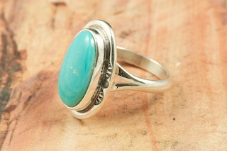 Genuine Manassa Turquoise set in Sterling Silver Ring. This Turquoise is also referred to as King�s Manassa Turquoise. The Manassa Turquoise mine is located in Manassa, Conejos County, Colorado. Created by Navajo Artist Mike Ganadonegro. Signed by the artist.